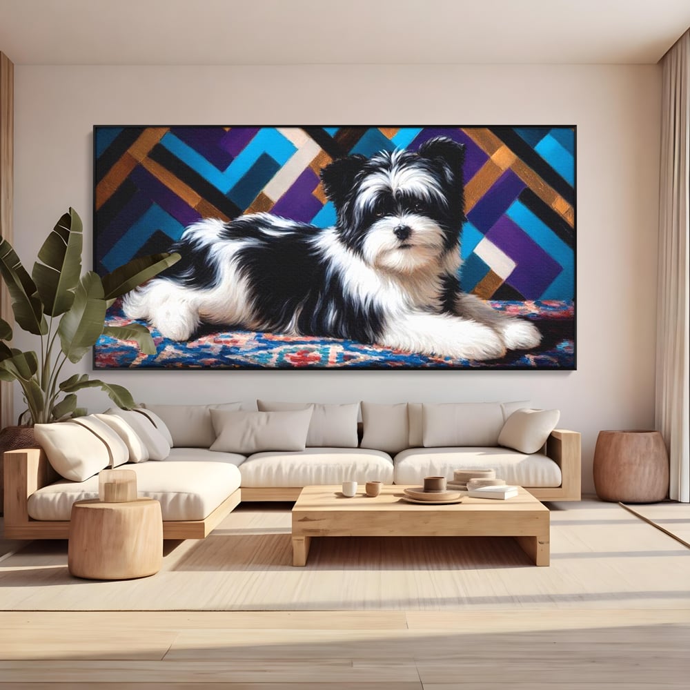Tablou canvas cu tablou canvas cu catel pufos alb-negru, in rama de aluminiu negru, pe perete intr-un living